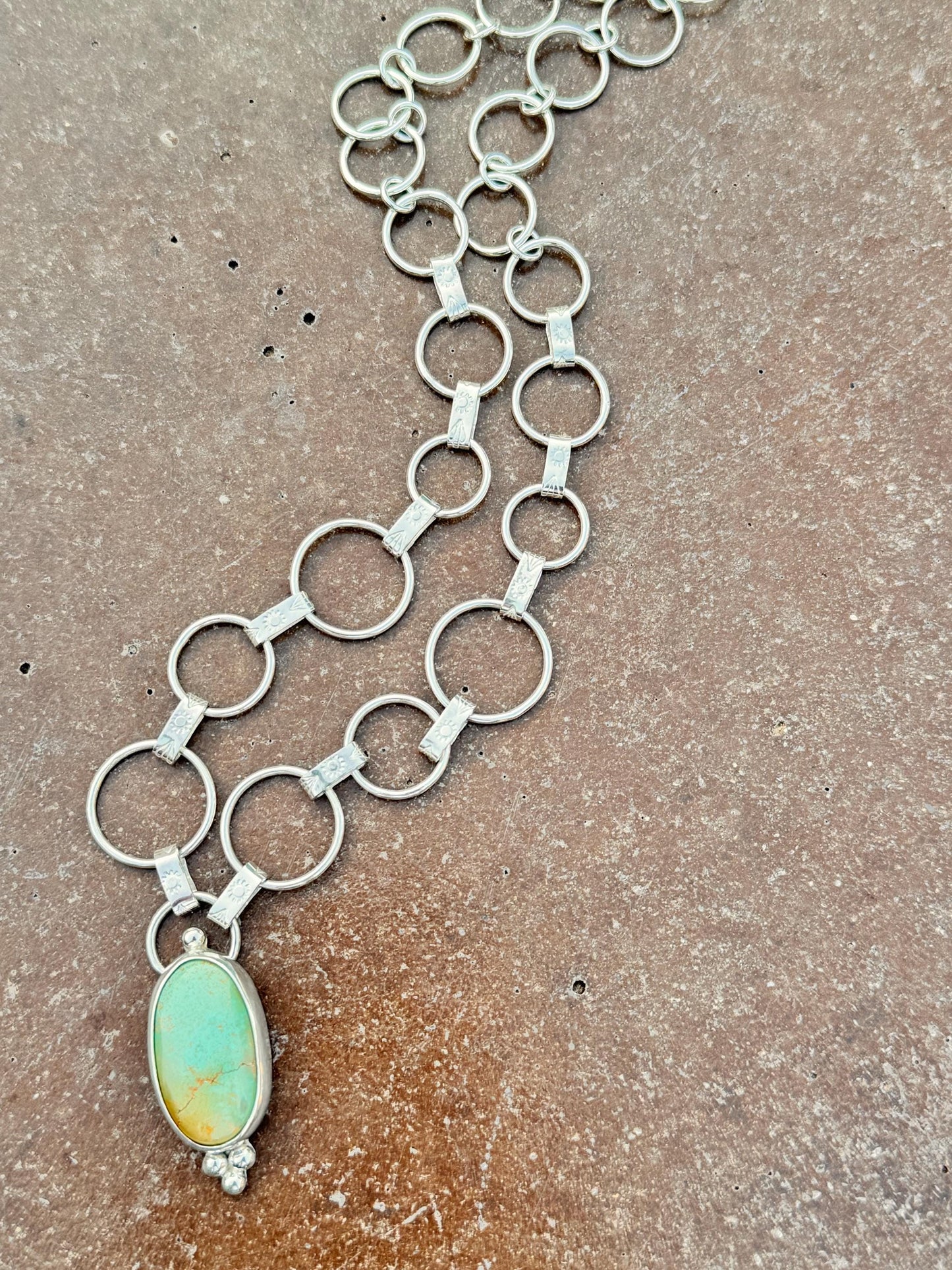 Artisan sterling silver chain with hand-forged textured links and Royston turquoise centerpiece.