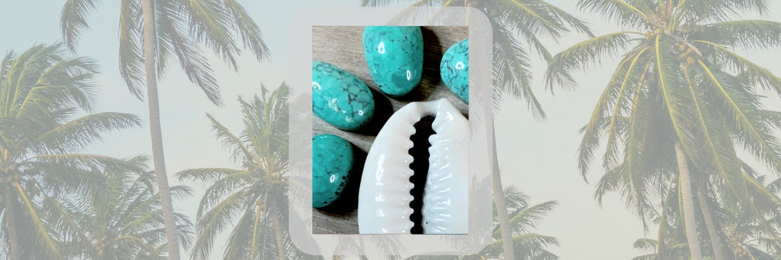 turquoise stones framing a cowrie shell - planning stage before making a bolo