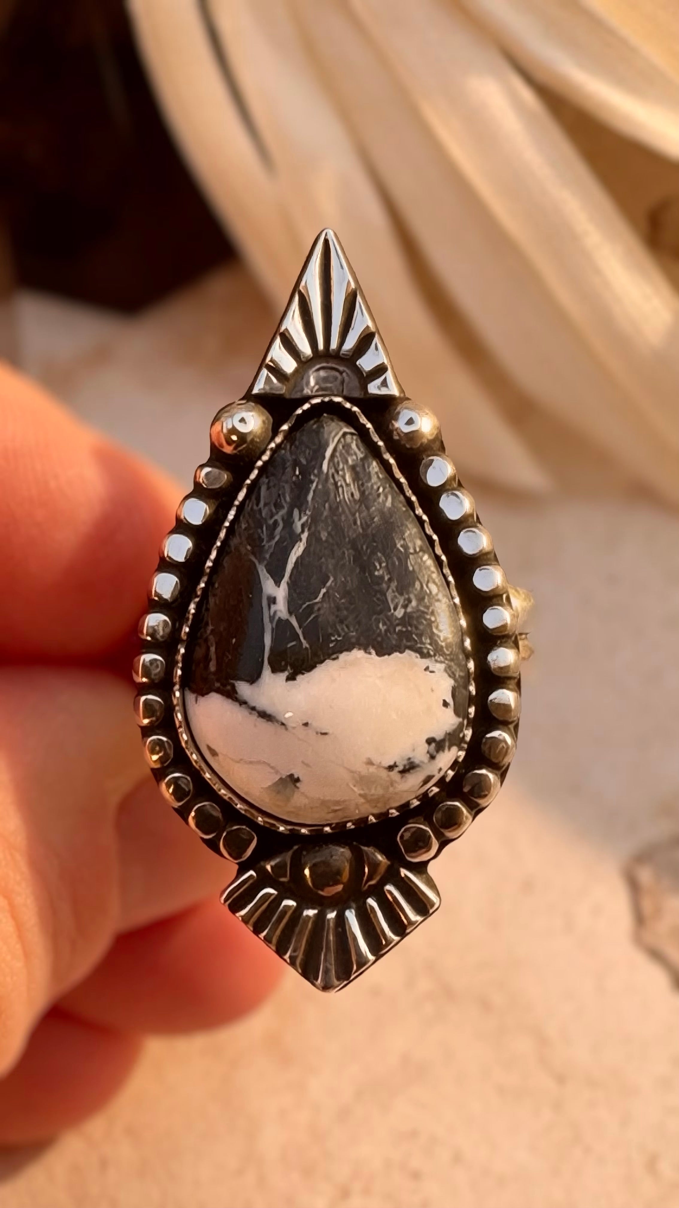 White Buffalo statement ring set in fine and sterling silver with sculptural sunburst details.