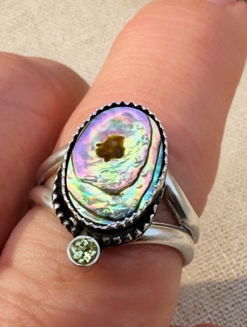 Handcrafted abalone and peridot ring in oxidized sterling silver with split shank band