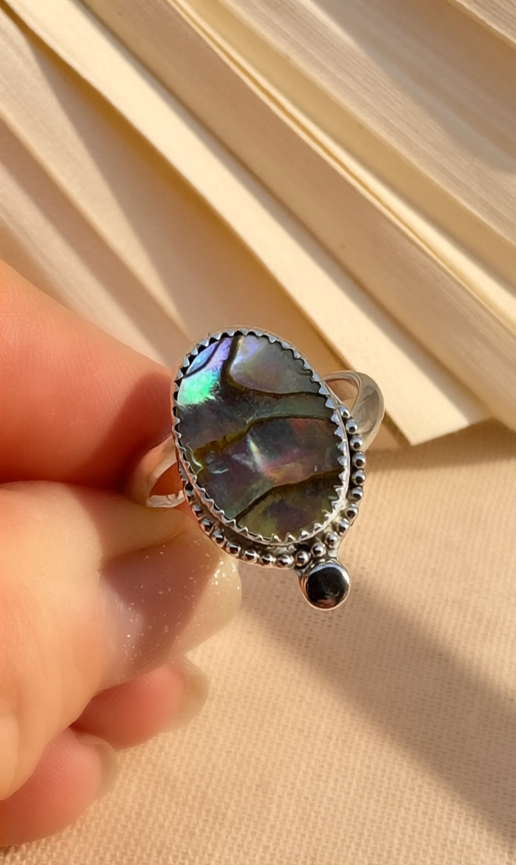 Abalone shell ring in sterling silver with bypass shank, size 8