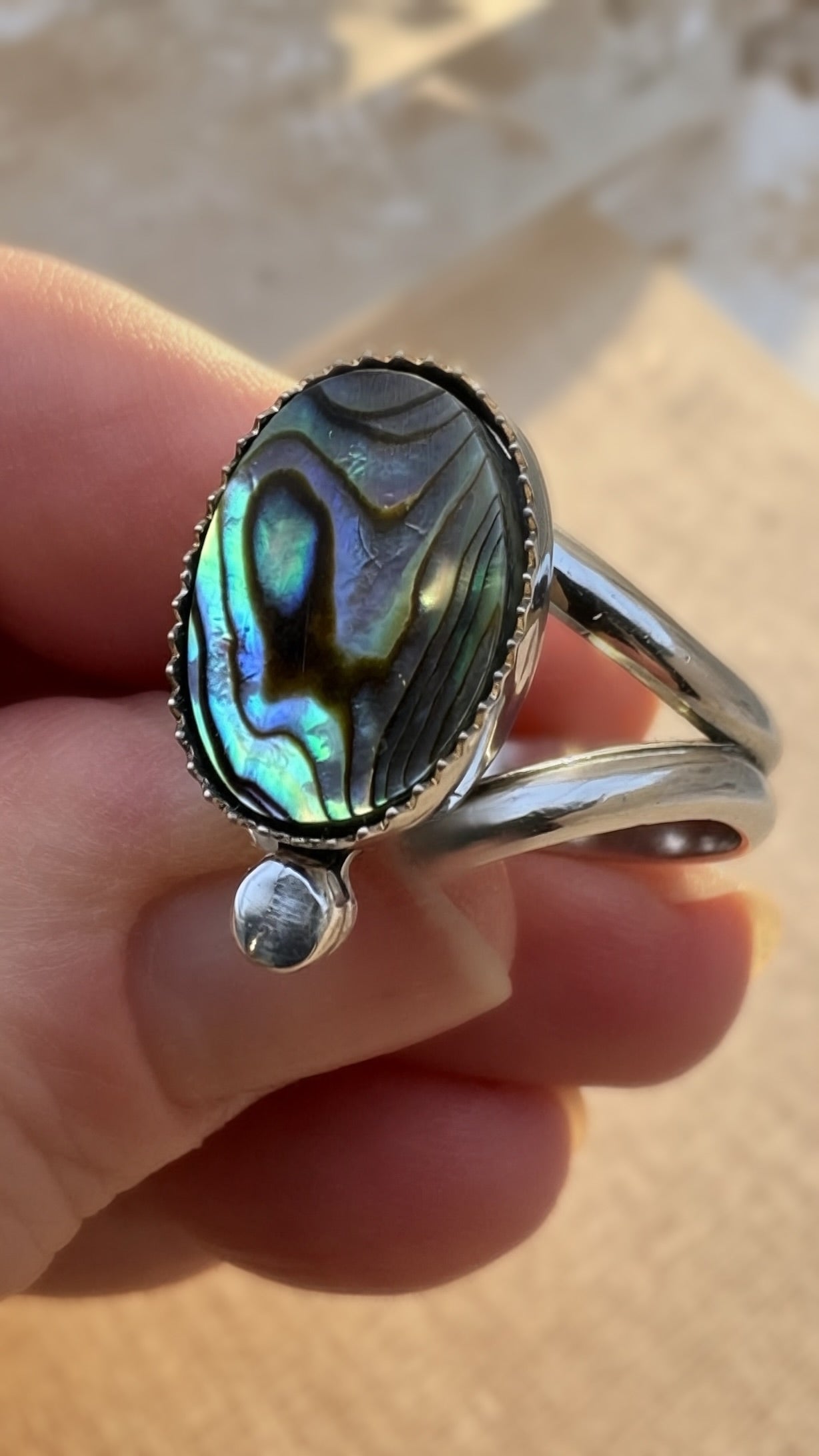 Close up of an abalone shell ring