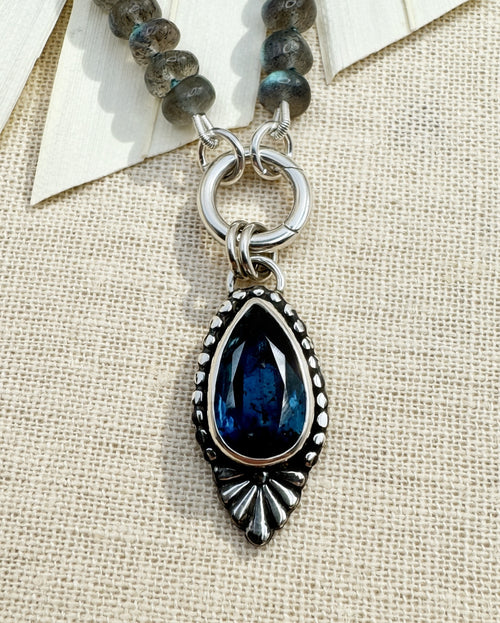 Full Blue Hour Bloom necklace with hand-knotted labradorite beads, sterling silver charm keeper and faceted teal kyanite floral pendant.