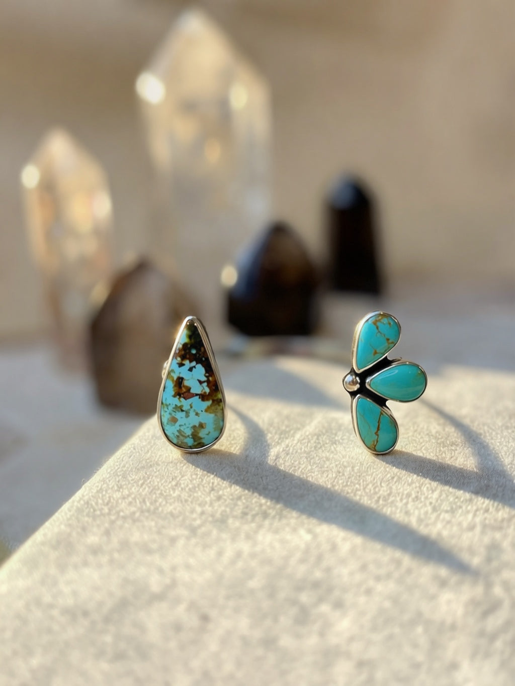 Turquoise bracelet on a textured surface with crystal formations in the background