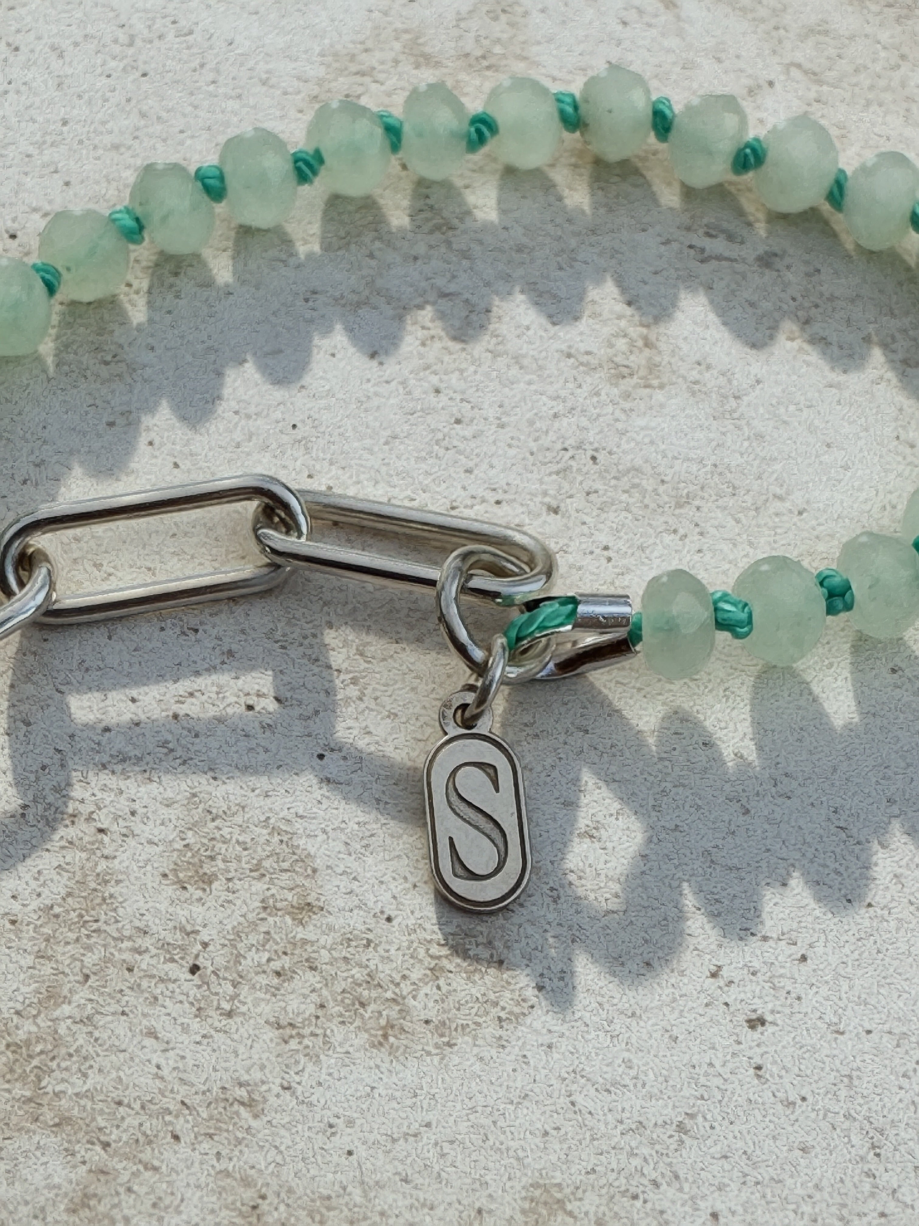 Hand-knotted teal silk seafoam rondelle necklace with serrated bezel set turquoise cabochon and sterling silver charm keeper toggle clasp, Sun Salt Silver