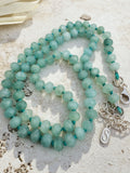Uniform faceted candy jade rounds hand-knotted on blue-dyed turquoise silk with sterling silver clasp, 17 inch necklace by Sun Salt Silver