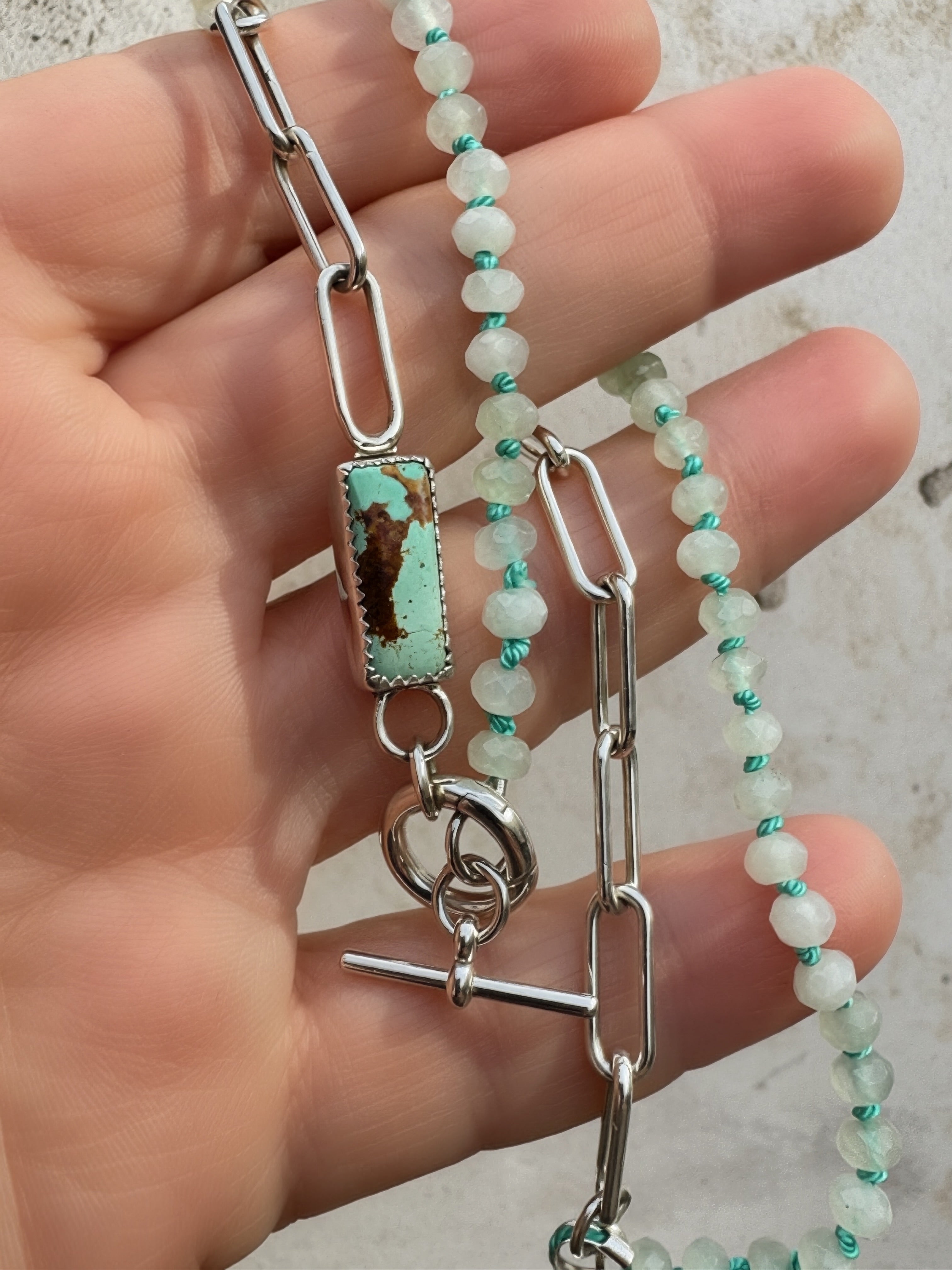 Hand-knotted teal silk seafoam rondelle necklace with serrated bezel set turquoise cabochon and sterling silver charm keeper toggle clasp, Sun Salt Silver