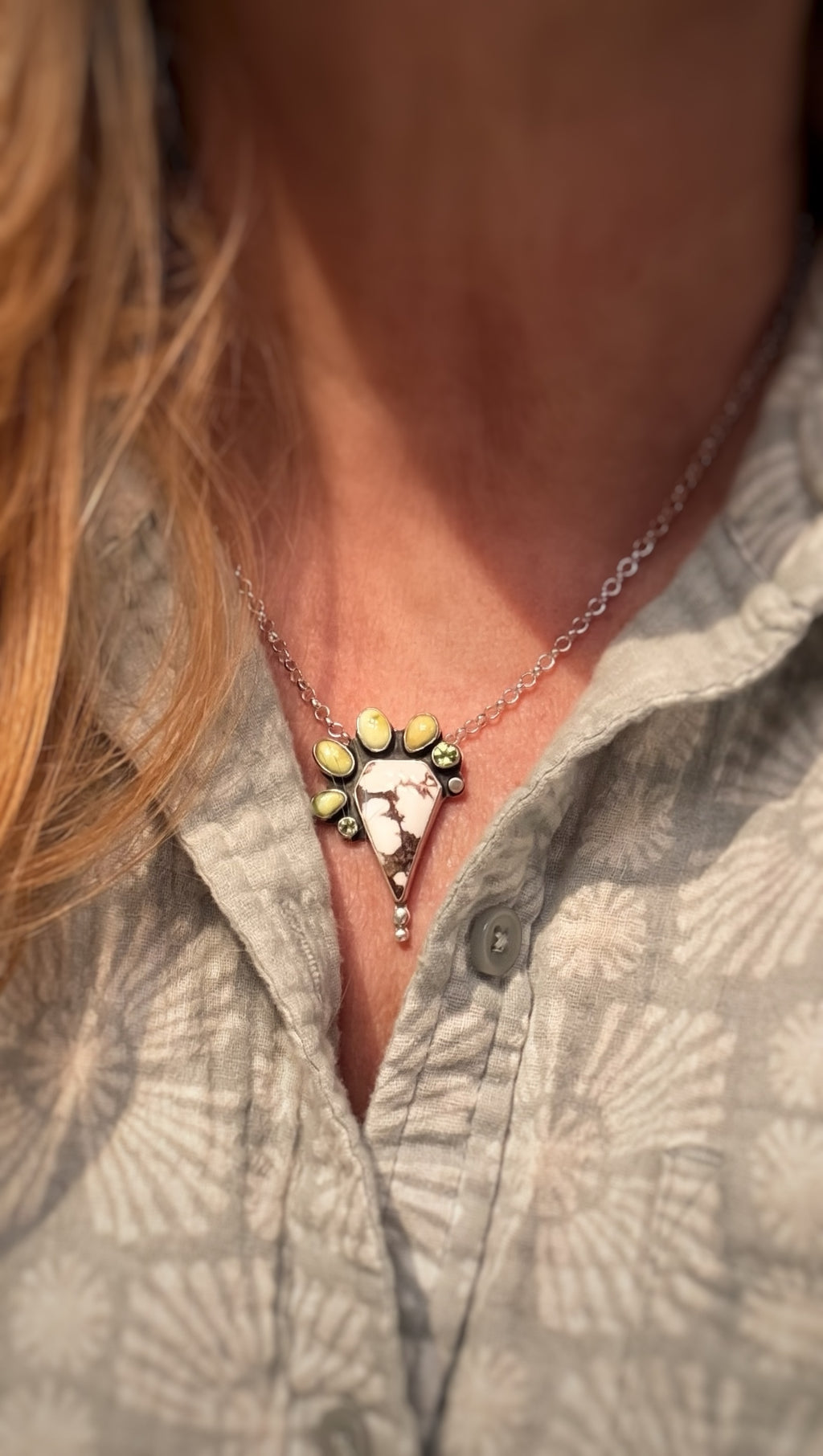 Woman wearing wild horse stone pendant necklace on 18-inch sterling silver chain