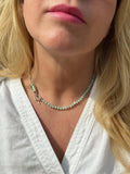 Handmade sterling silver turquoise charm keeper necklace with seafoam rondelle beads on hand-knotted teal silk, worn at collarbone, Sun Salt Silver Caye collection