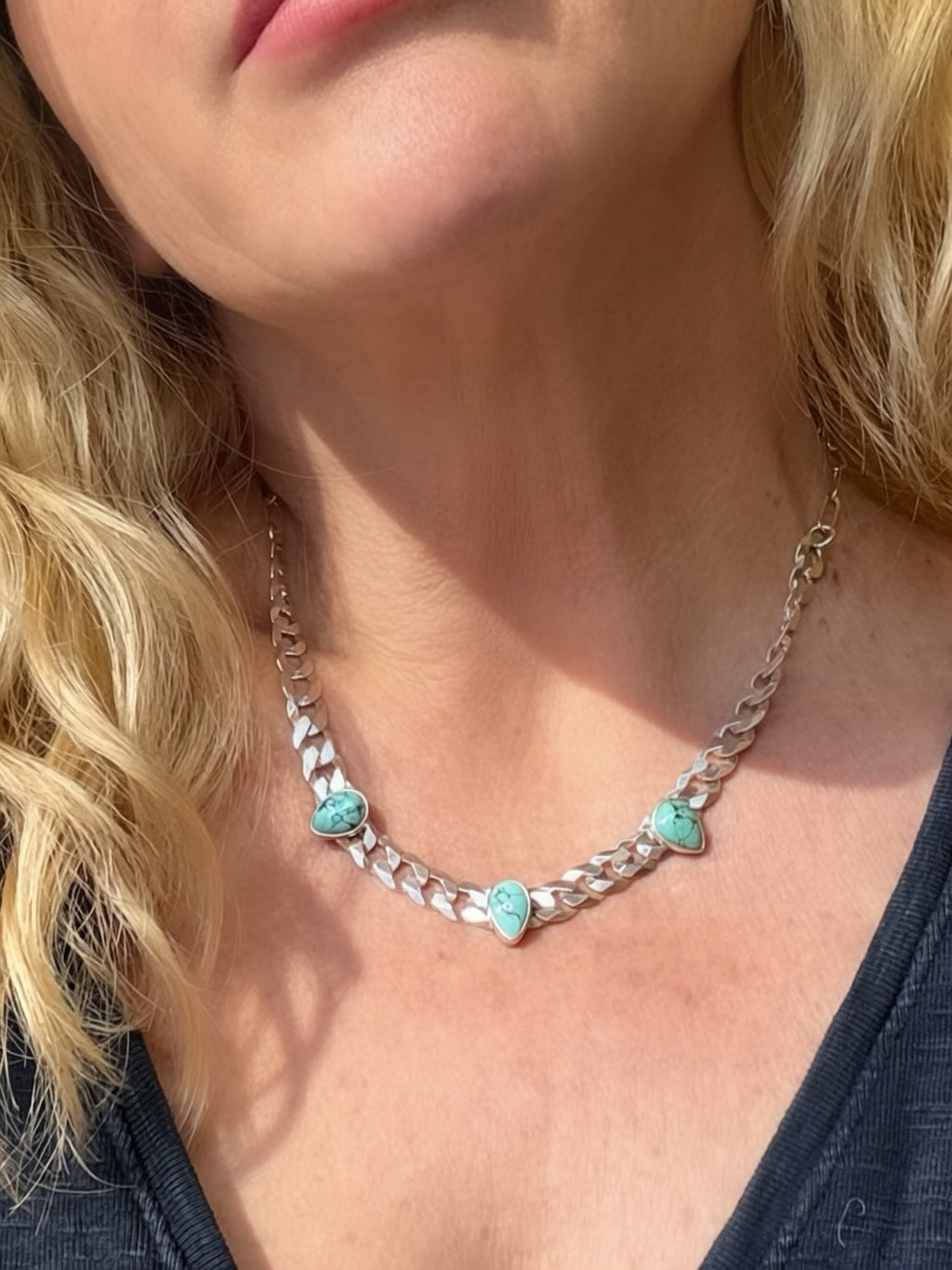 Blue Reign turquoise necklace worn at a longer length, showing the paperclip chain meeting the wider curb links.