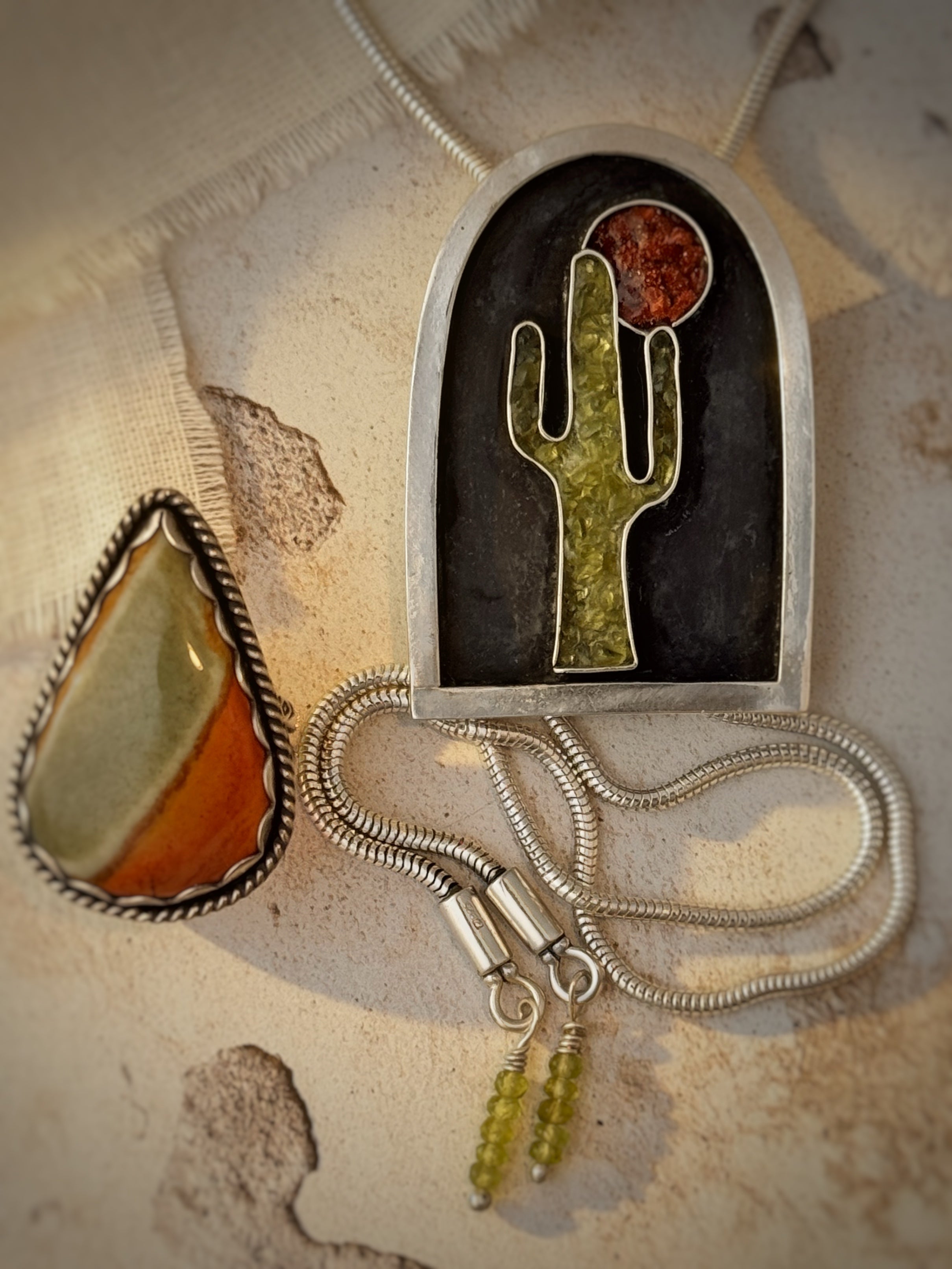 Jewelry with a cactus design on a textured surface
