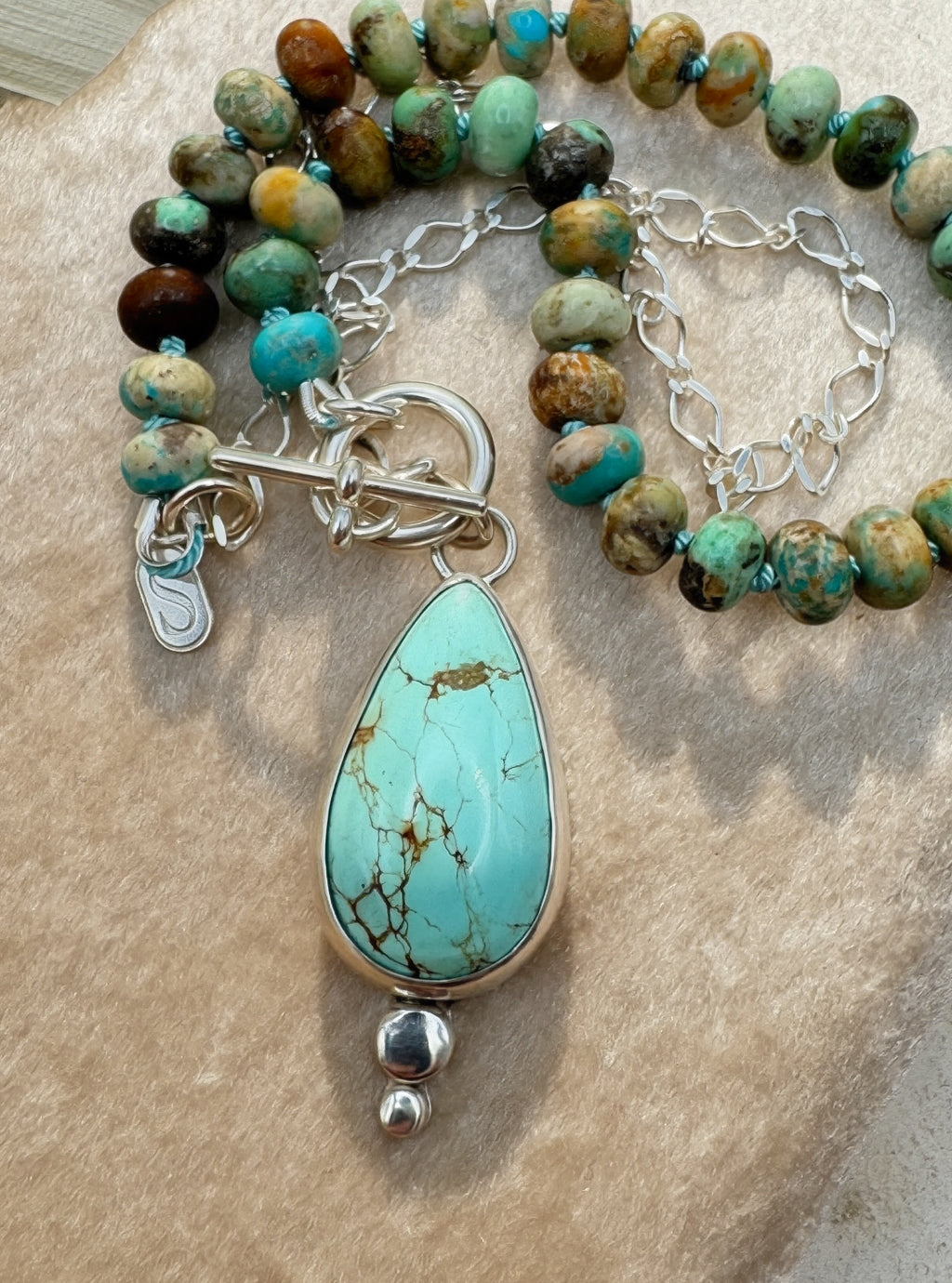 Glacier blue turquoise teardrop pendant in sterling silver bezel setting with natural turquoise rondelle bead strand and charm keeper toggle clasp, Sun Salt Silver Caye Collection