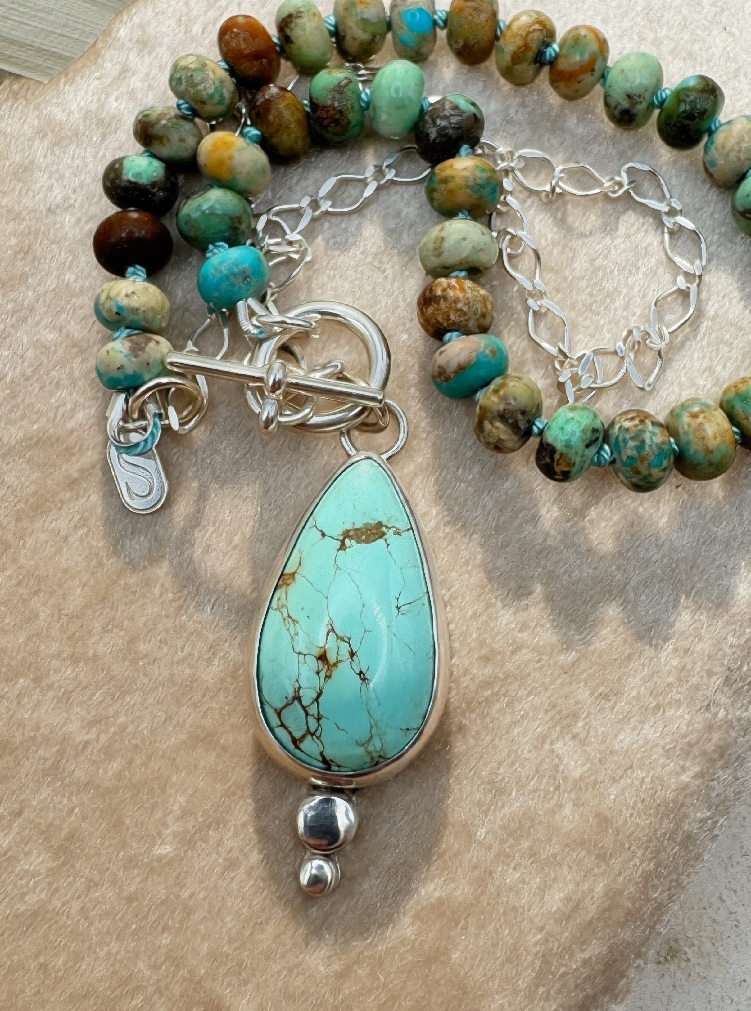 Glacier blue turquoise teardrop pendant in sterling silver bezel setting with natural turquoise rondelle bead strand and charm keeper toggle clasp, Sun Salt Silver Caye Collection
