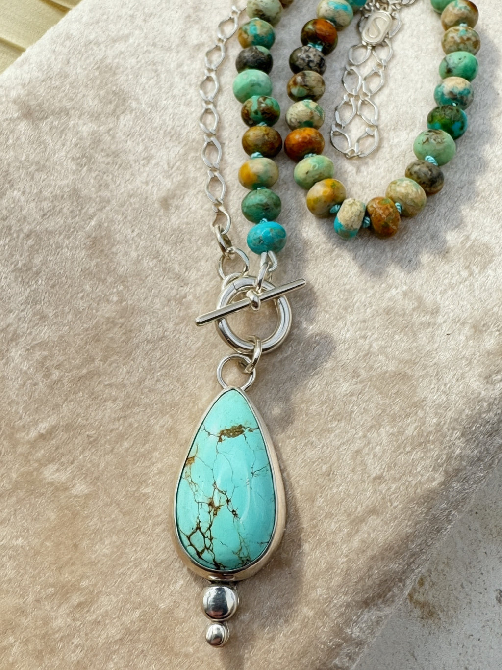Glacier blue turquoise teardrop pendant in sterling silver bezel setting with natural turquoise rondelle bead strand and charm keeper toggle clasp, Sun Salt Silver Caye Collection