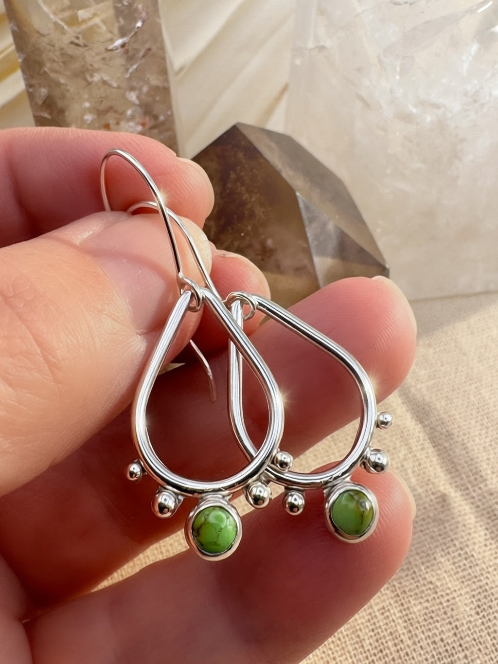Hand-fabricated sterling silver drop earrings with vivid green Sonoran Gold Turquoise cabochons, high-polish finish, simple ear wire, 1.75" length