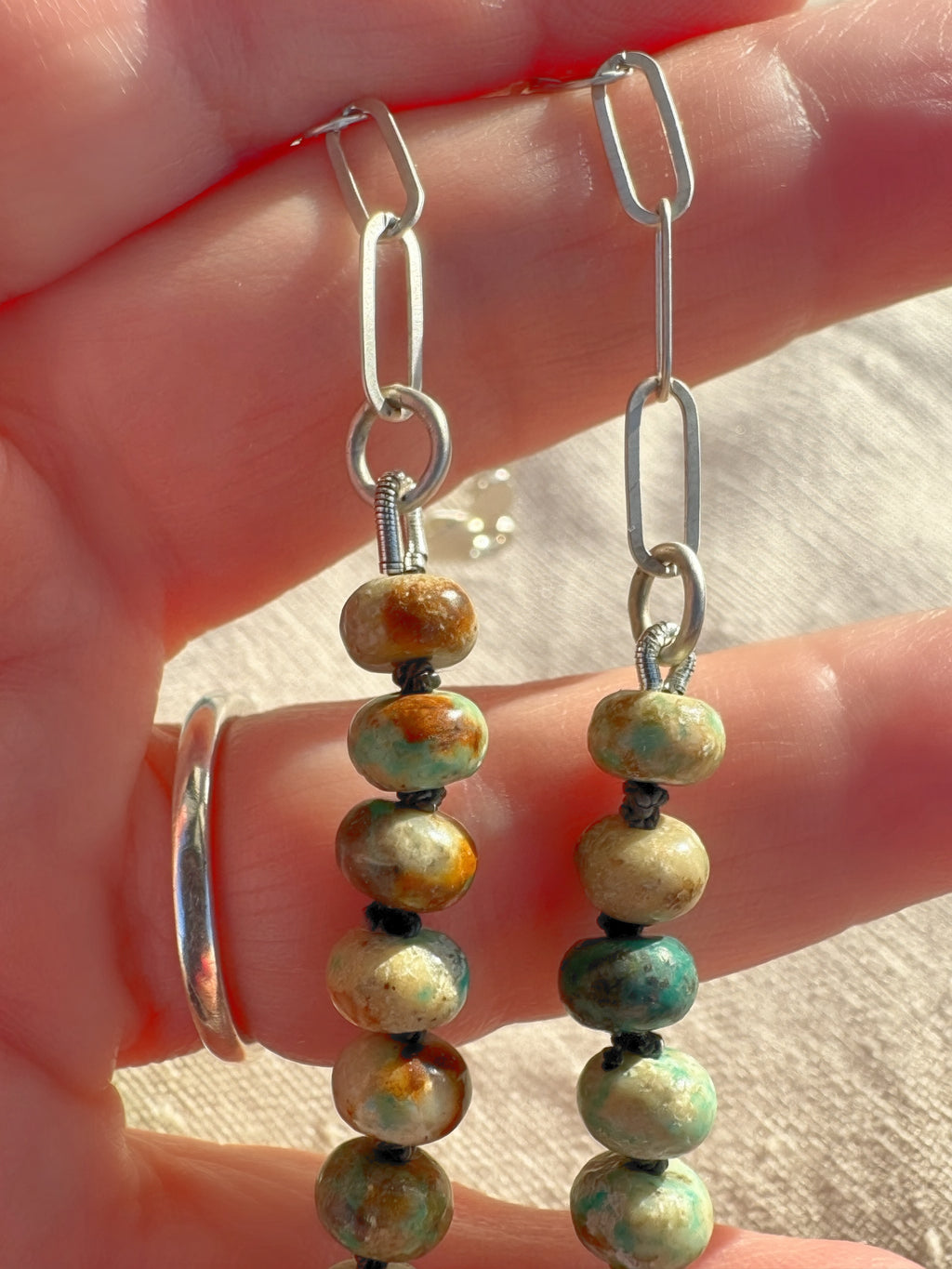 Close up of the turquoise beads to chain transition of the Desert Aurora necklace