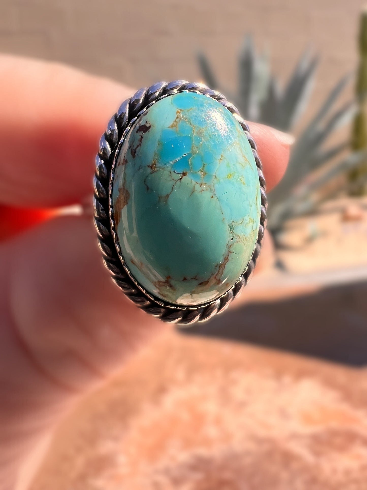 Oval turquoise ring set in silver.