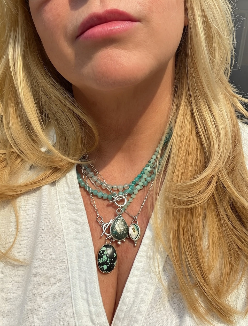 Natural pyrite-flecked turquoise teardrop cabochon in hand-fabricated sterling silver serrated bezel with granulation ball detail, Caye collection Sun Salt Silver