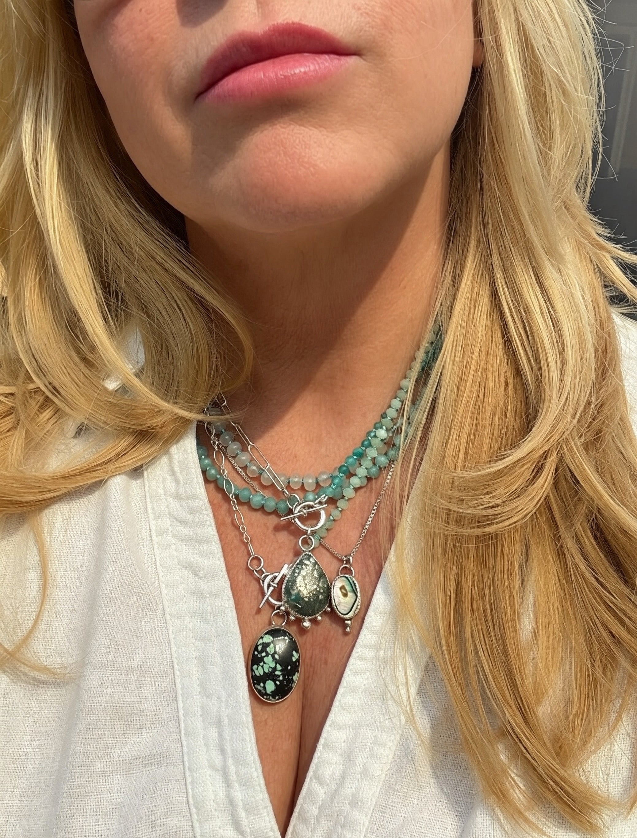 Natural pyrite-flecked turquoise teardrop cabochon in hand-fabricated sterling silver serrated bezel with granulation ball detail, Caye collection Sun Salt Silver