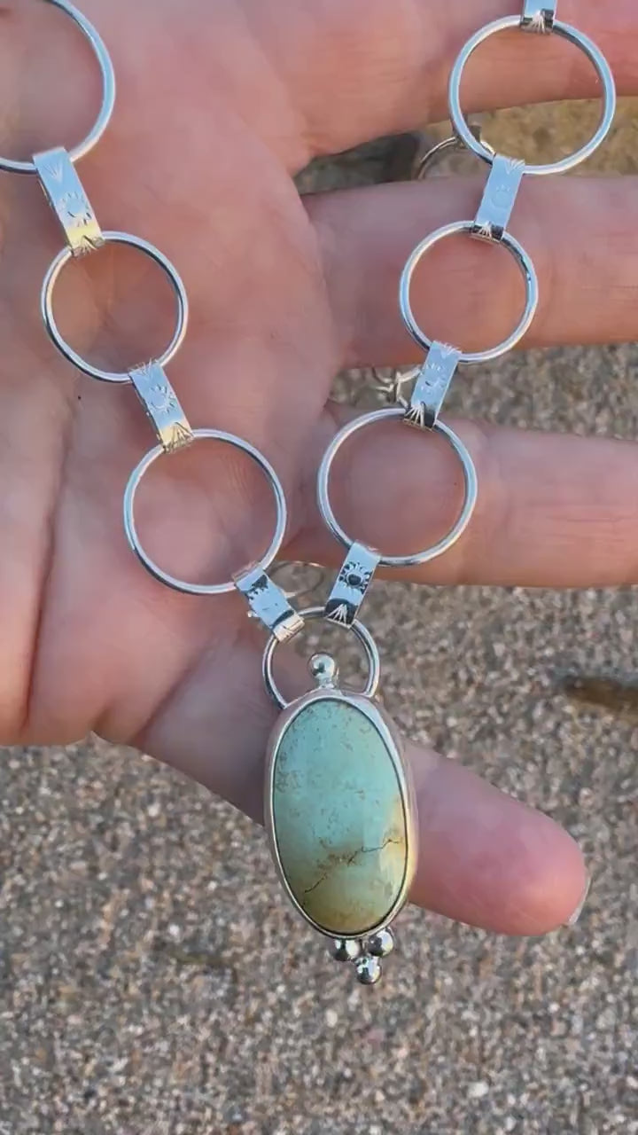 Artisan sterling silver chain with hand-forged textured links and Royston turquoise centerpiece.