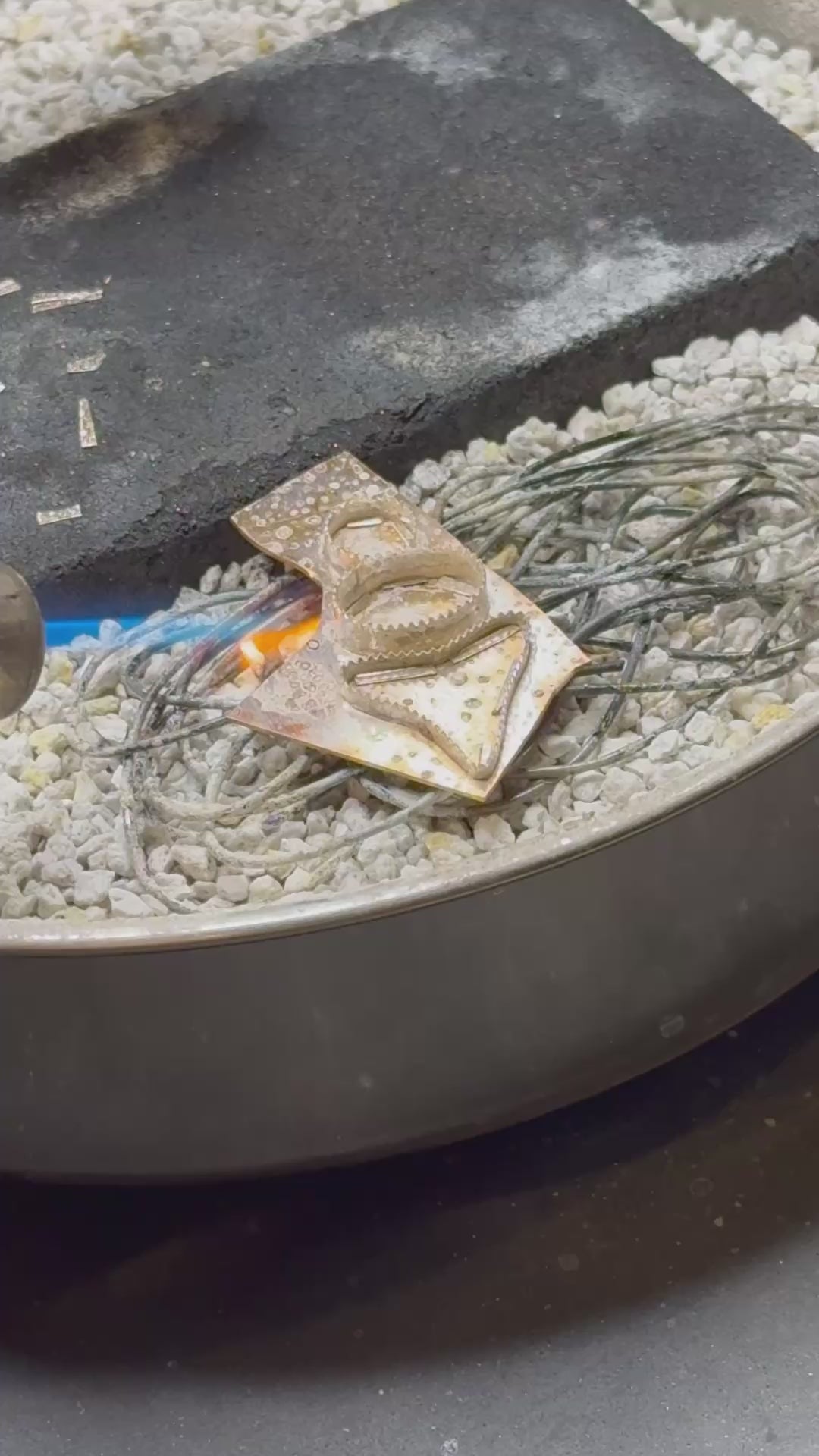 Behind the scenes look at the abalone and shark tooth ring being made, showing soldering and sawing.