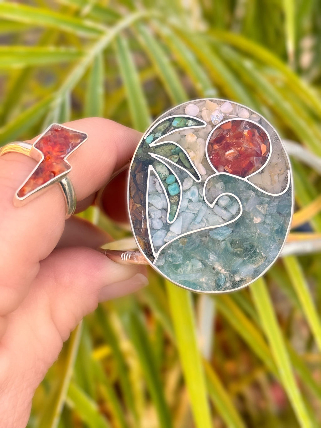 Handcrafted sterling and fine silver inlay cuff featuring crushed aquamarine, fire opal, tiger's eye, turquoise, yellow opal and larimar